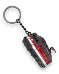 Trainimals "Glubschi" enamel keychain featuring a red and white Austrian Baureihe 1142 locomotive design with a metal ring and chain.